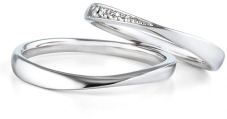 Pair of platinum wedding bands, one set with small diamonds