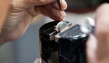 Ginza Diamond Shiraishi craftsman servicing a ring at the workbench
